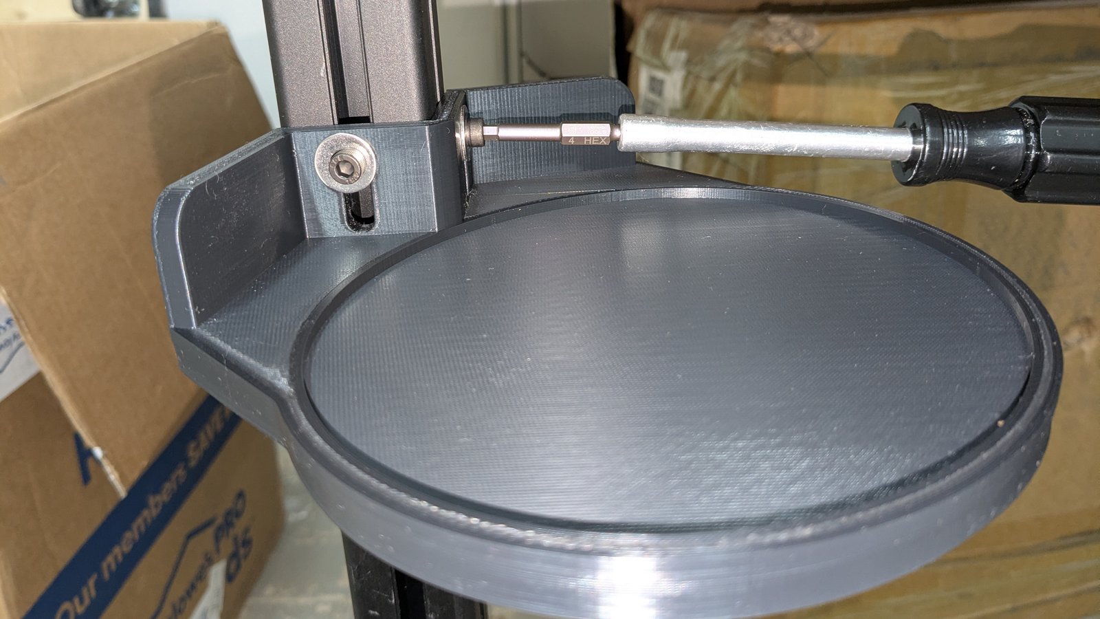 Printed heater mount being bolted to the extrusion frame